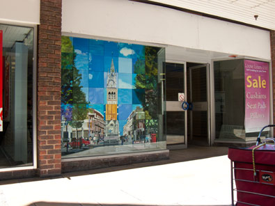 photo of painting in shop window from left